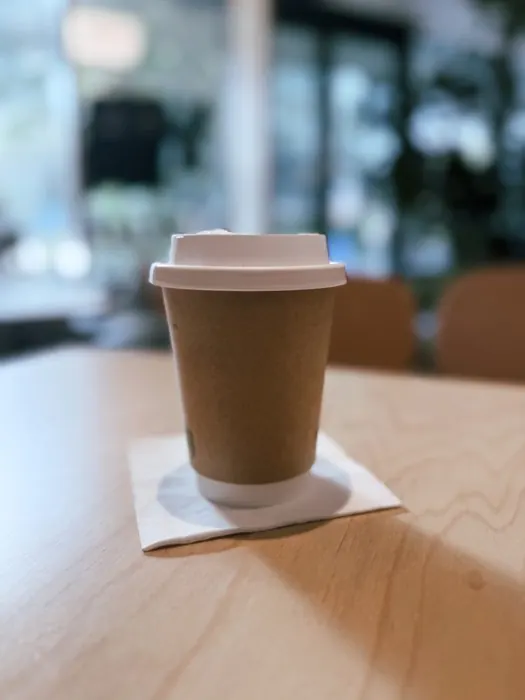 Takeaway coffee cup on a wooden table
